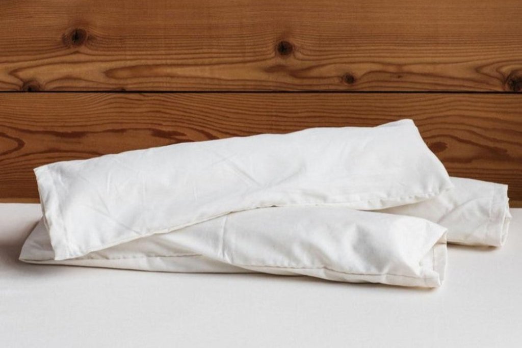 Wool Neck Roll Pillow by Holy Lamb Organics
